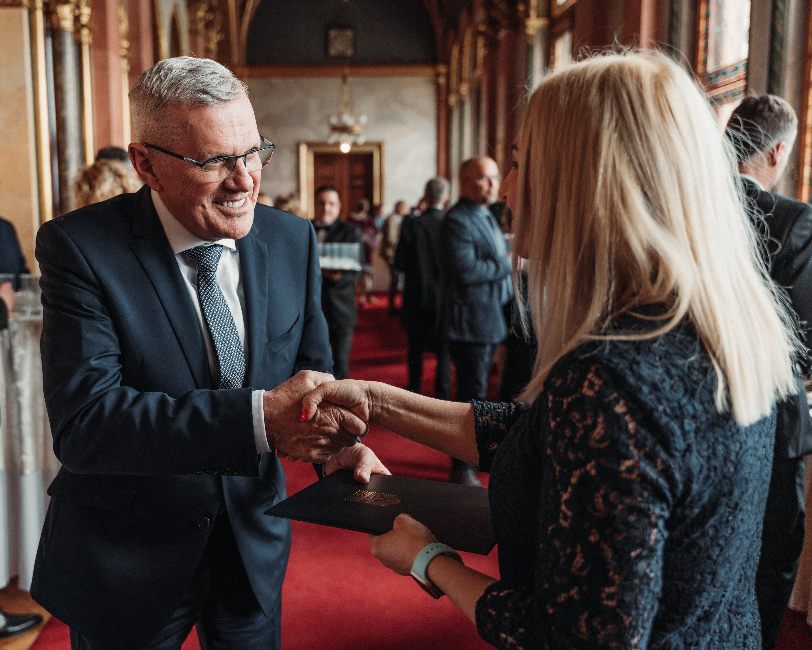 Handshake between guests at an awards ceremony