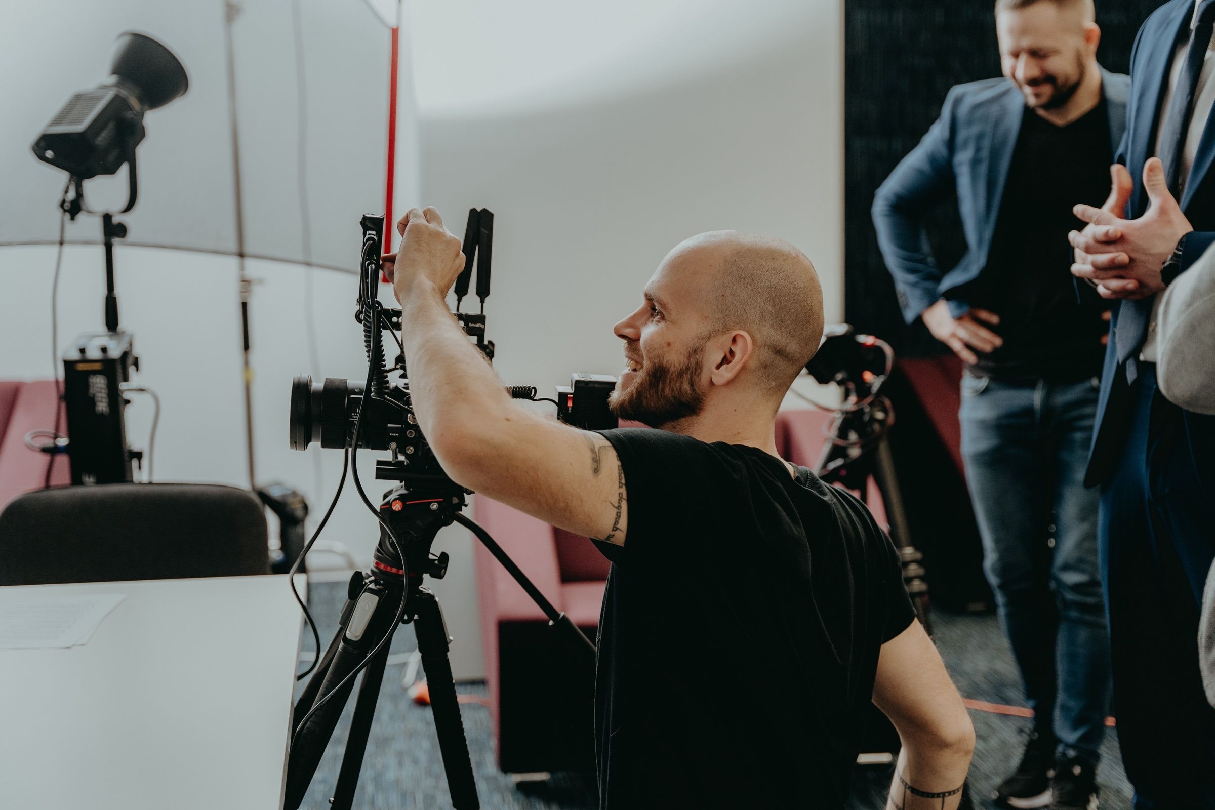 Camera operator lining up a shot on set