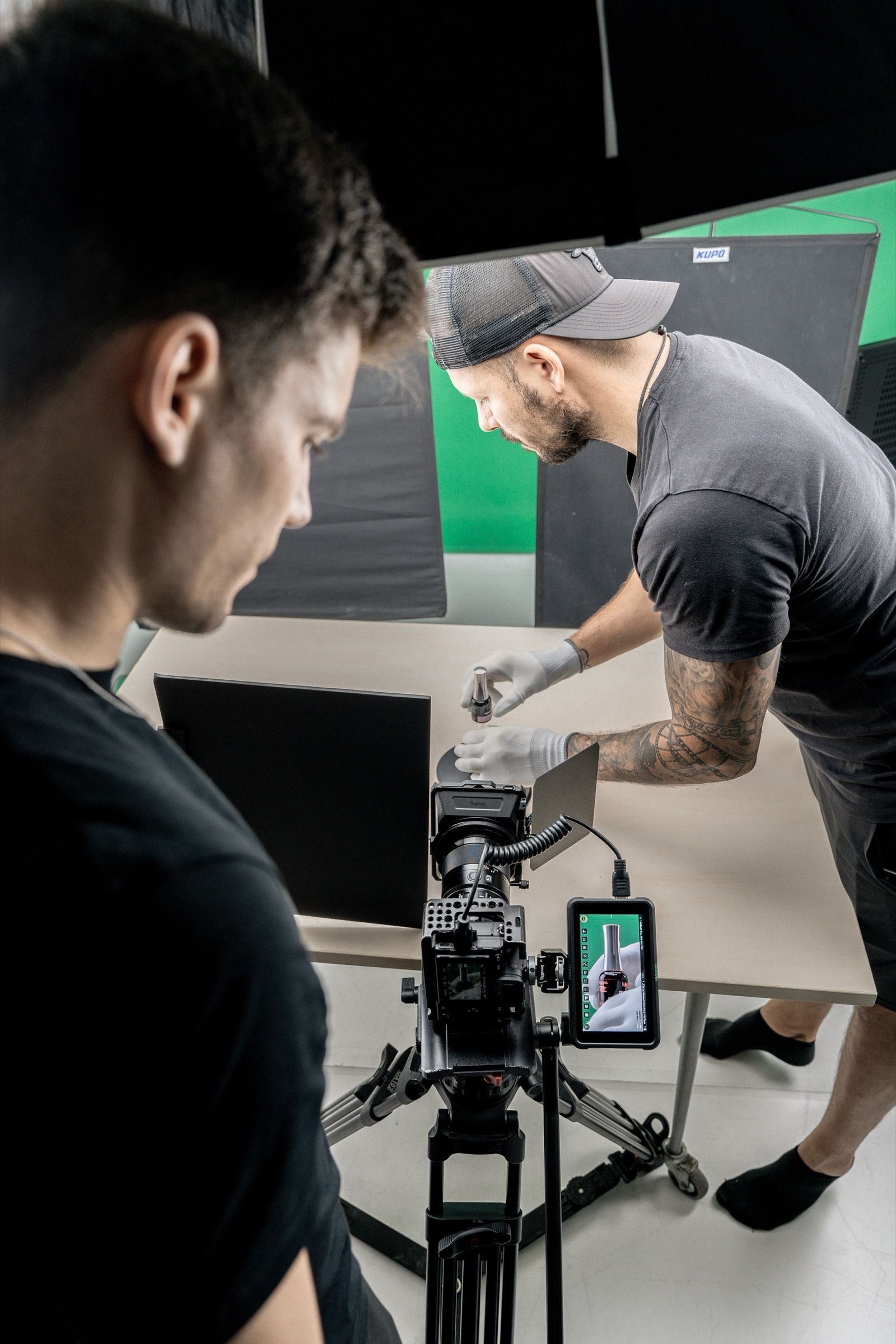 Checking the shot against the green screen