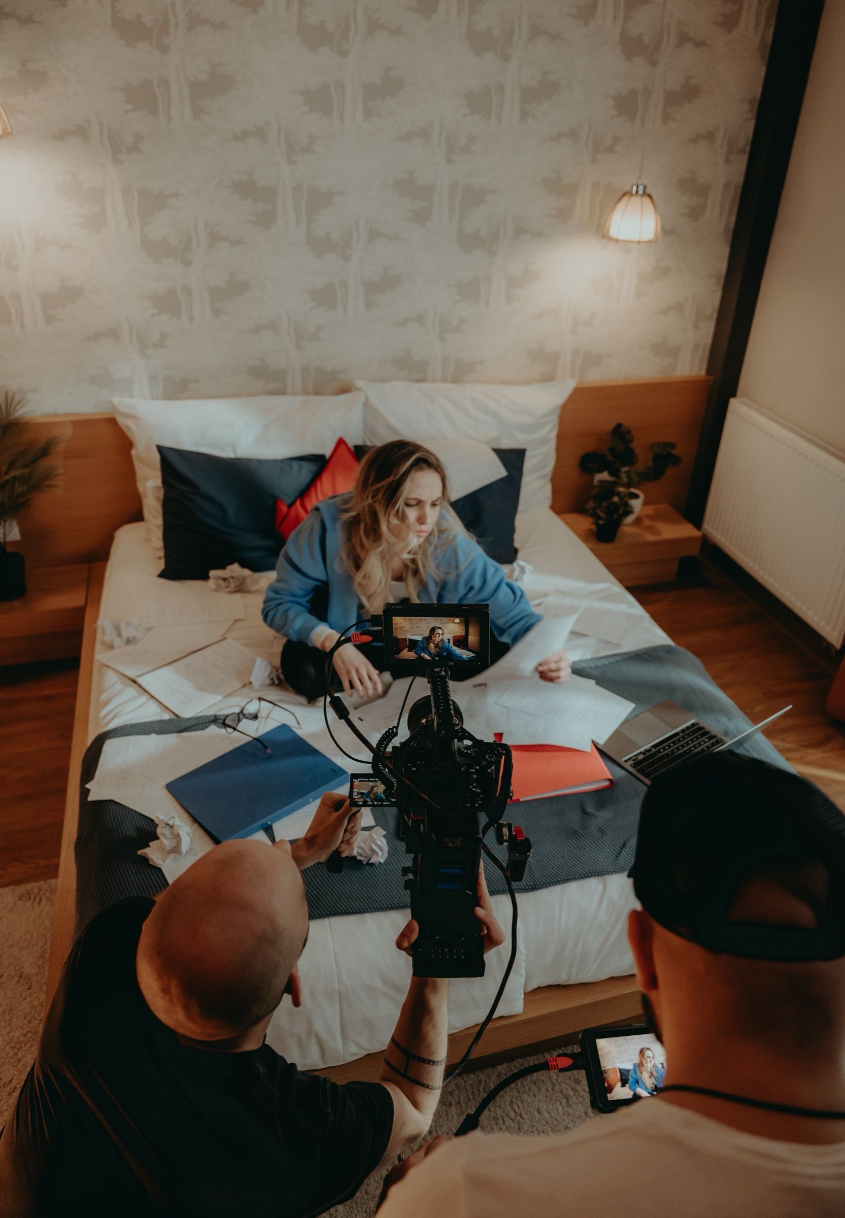 Filming a scene on a bedroom set