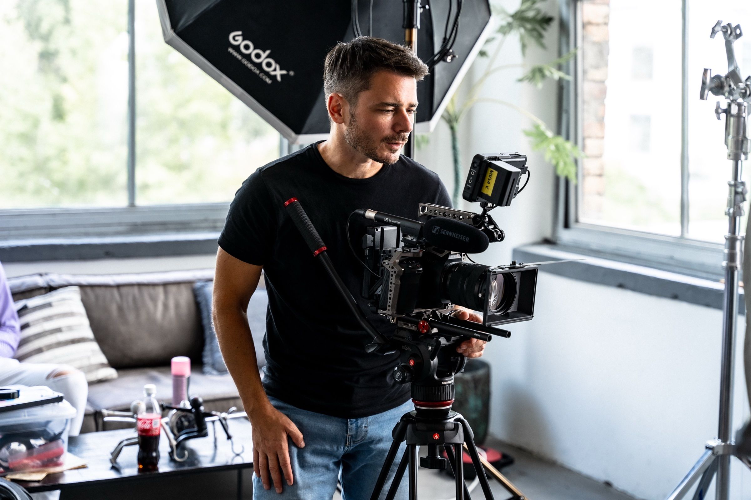 Videographer filming in an office