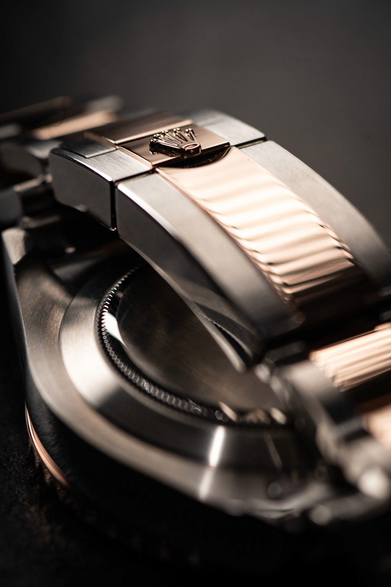 Close-up of a two-tone watch bracelet clasp