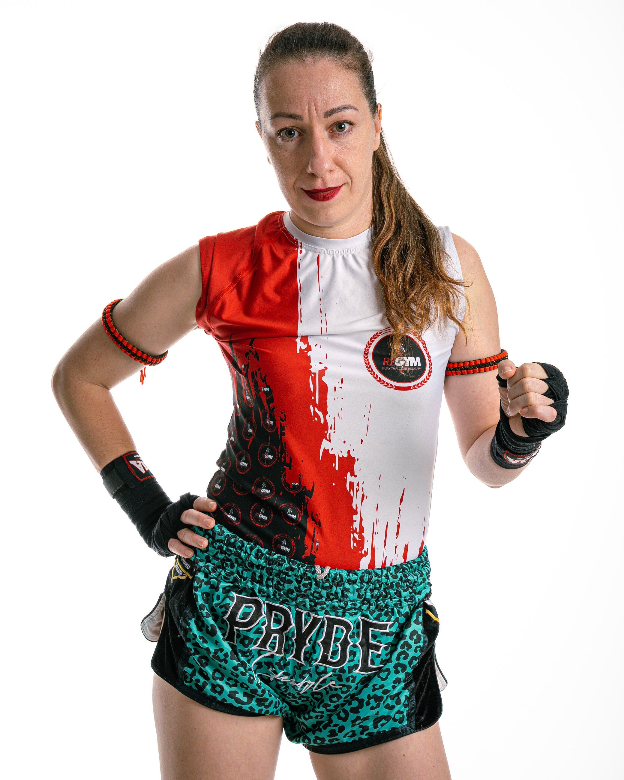 Female fighter in club kit and hand wraps