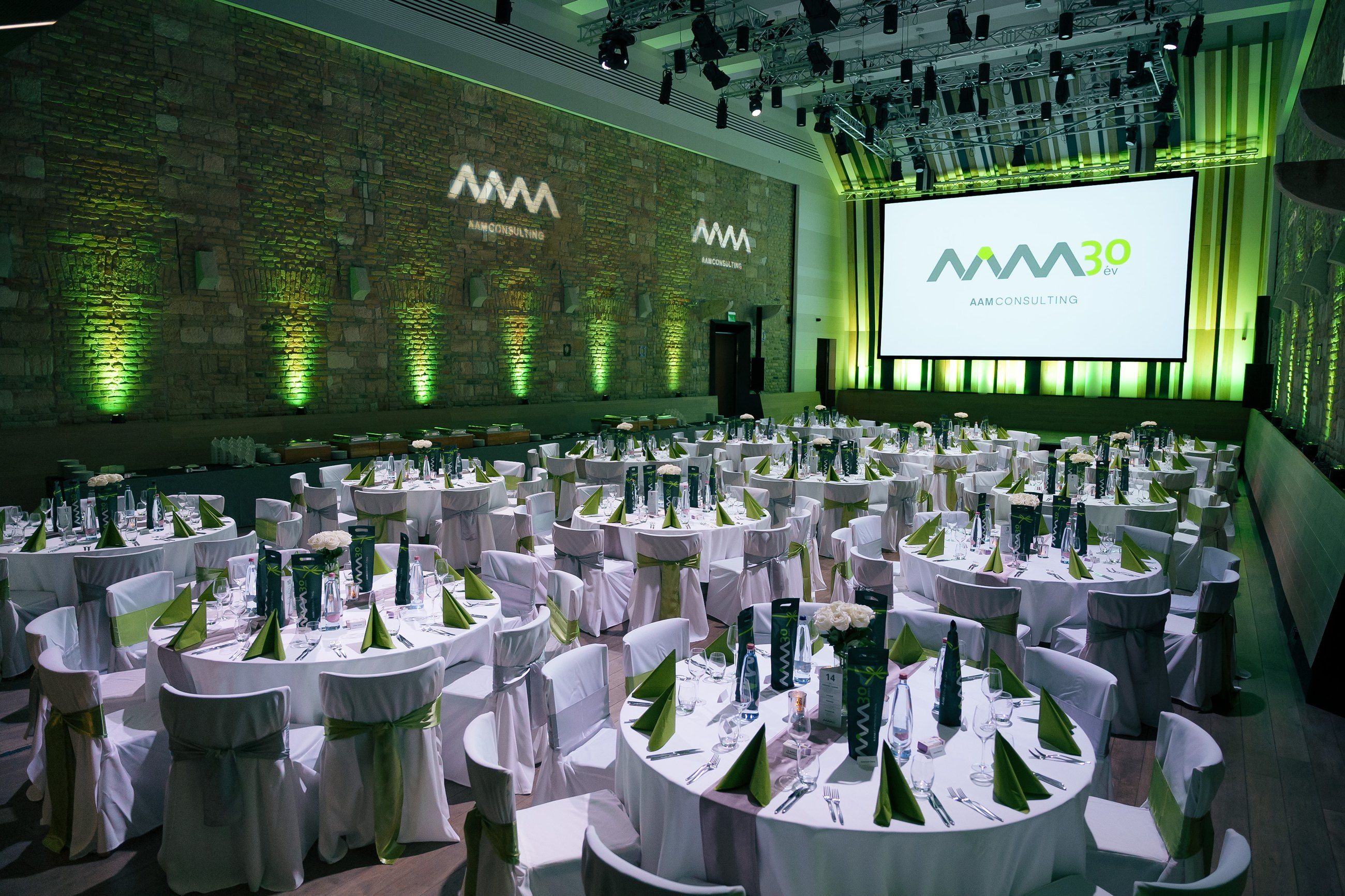 Banquet hall set for a gala under green light