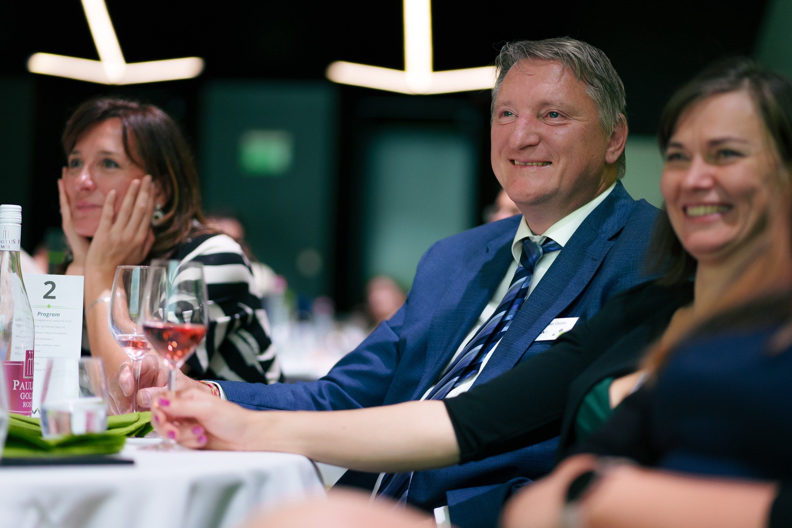 Guests laughing together at a gala table