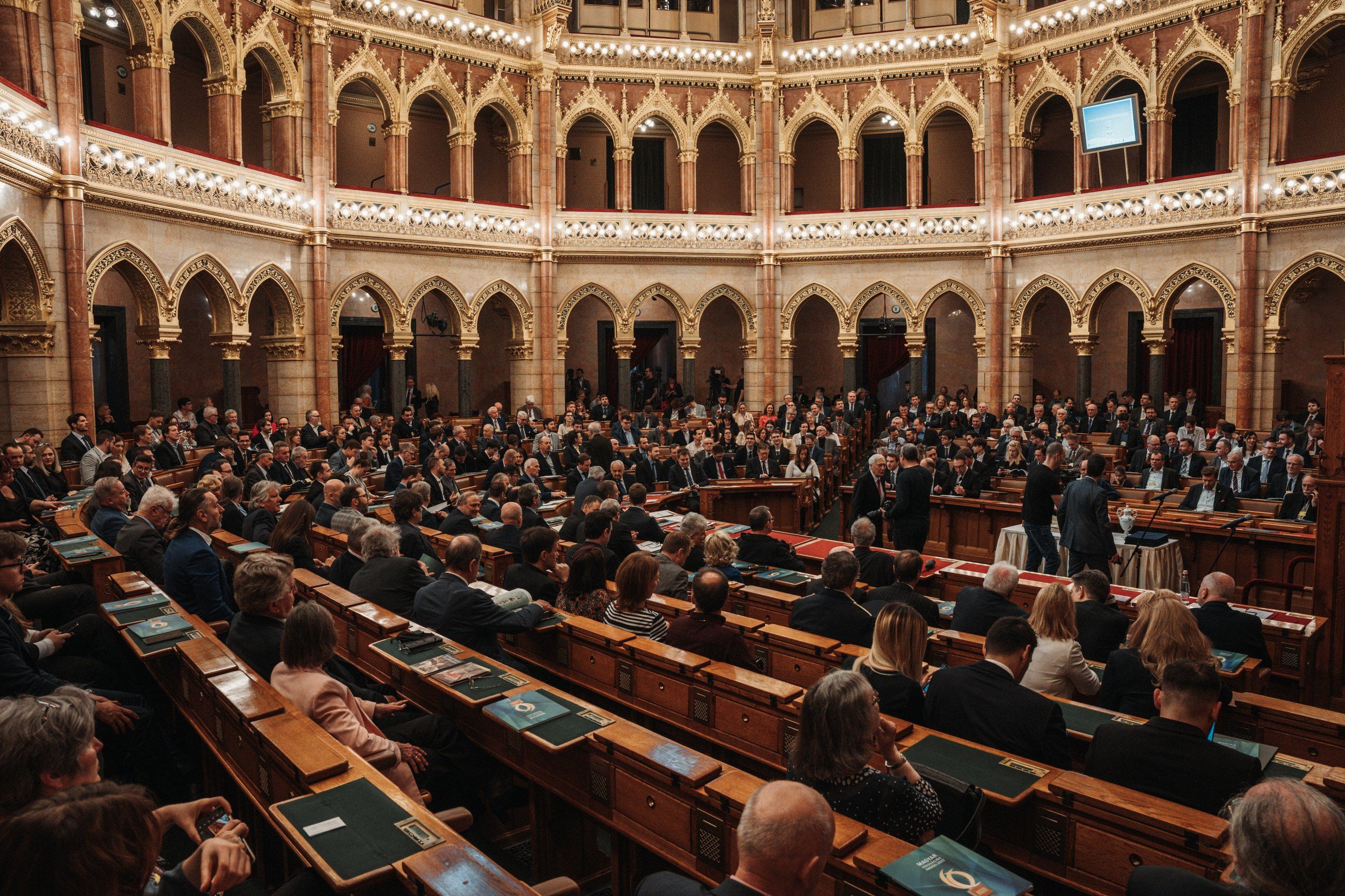 Award ceremony in a packed parliamentary chamber